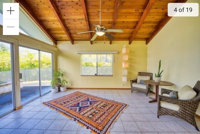 a living room with furniture and a table