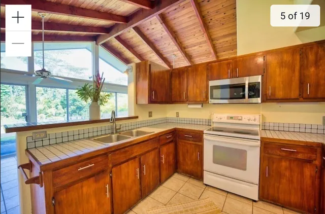 a kitchen with stainless steel appliances granite countertop a sink and cabinets