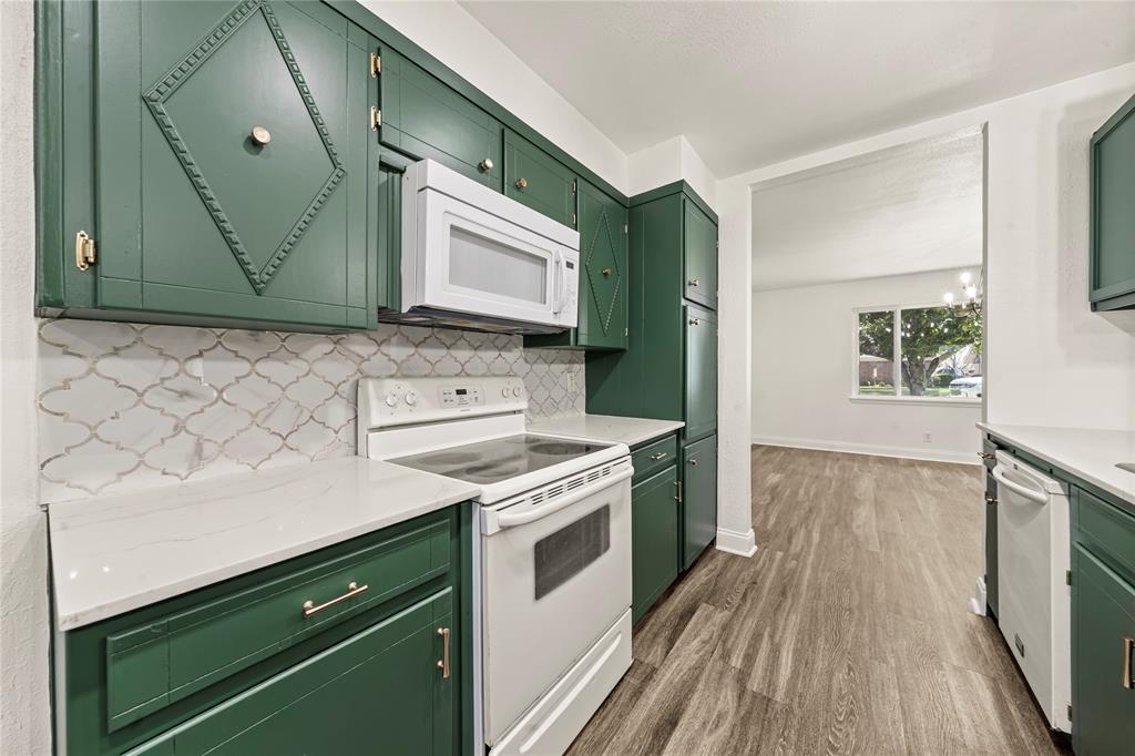 104 East Santa Anna Street Robinson, TX 76706 - Photo 20 of 36 a kitchen with a stove cabinets and wooden floor