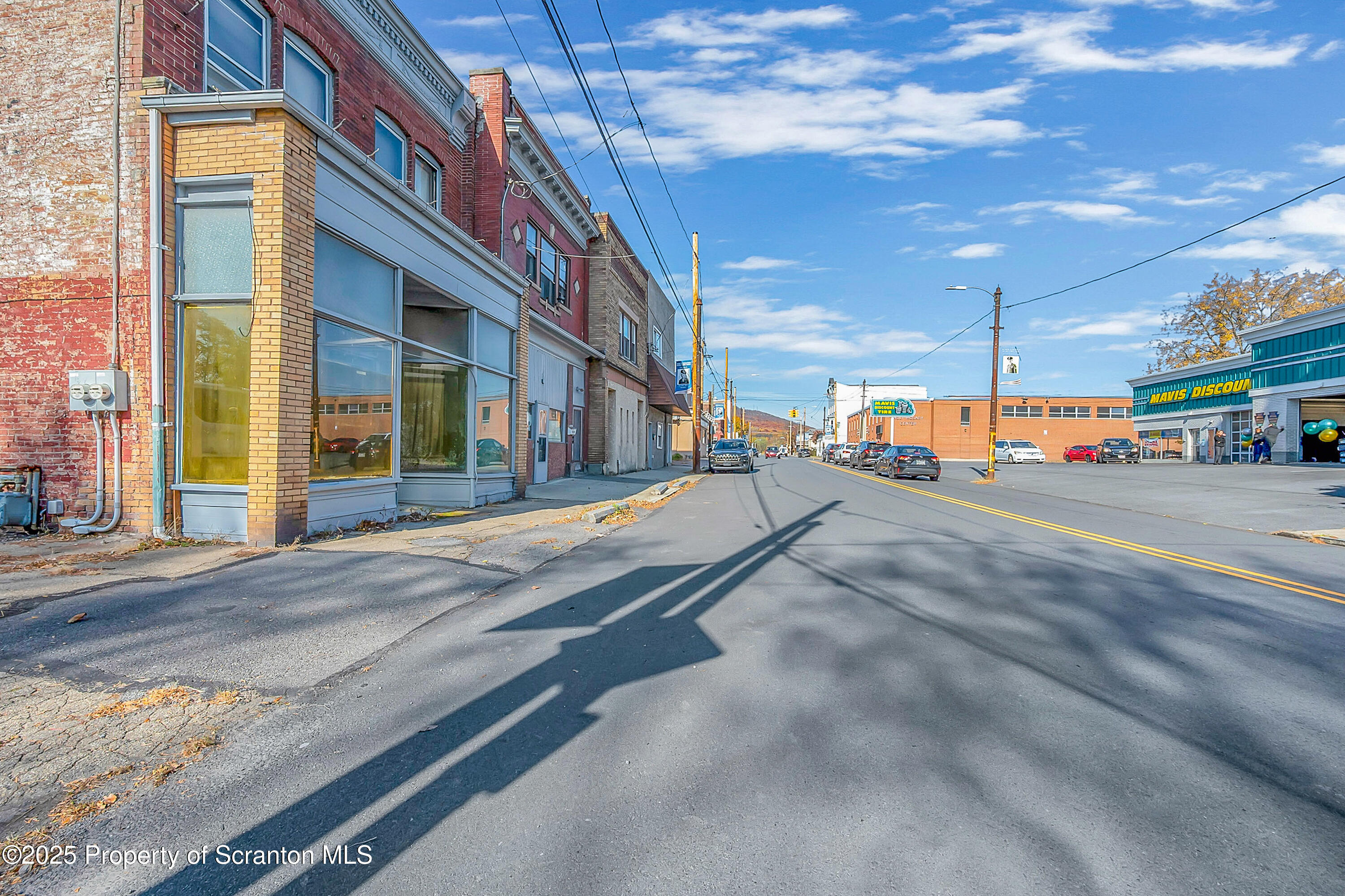 213 West Market Street Scranton, PA 18508 - Photo 2 of 7 a view of a building with car parked