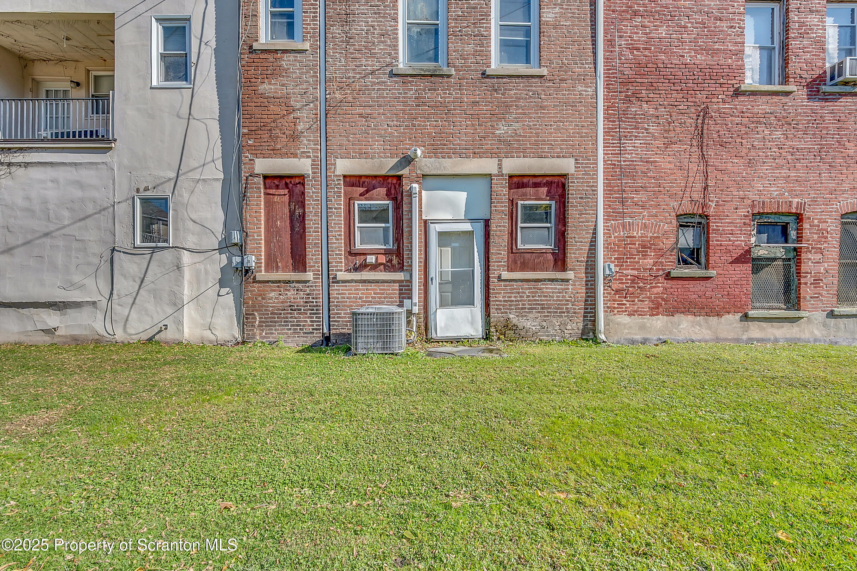 213 West Market Street Scranton, PA 18508 - Photo 5 of 7 a house with garden in front of it