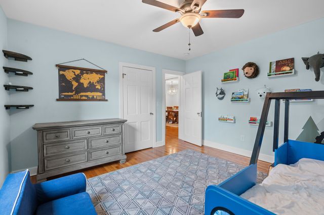 a bathroom with a sink a toilet a vanity and mirror