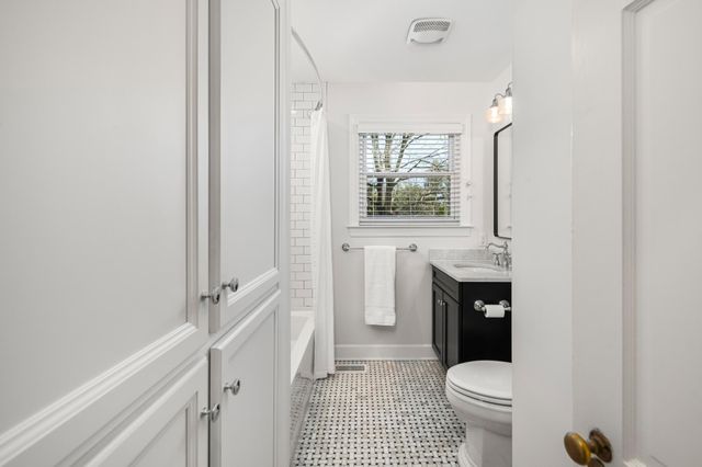 a bathroom with a sink a toilet and bathtub