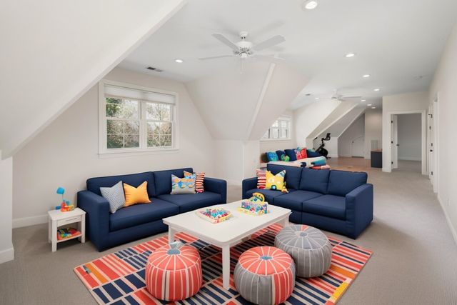 a view of a room with gym equipment and a flat screen tv