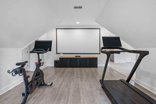 a view of an empty room and a bathroom