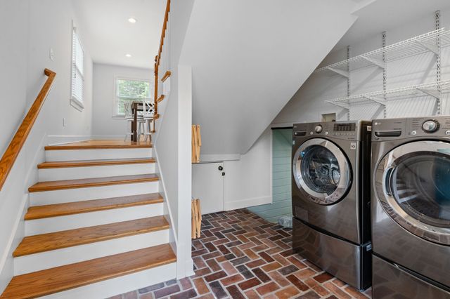 a view of potted plants in front of a house