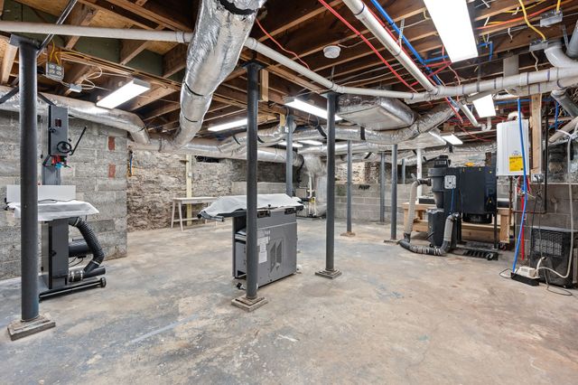 a view of a sitting area with chairs and table in the park