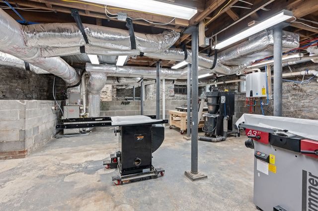 a view of a patio with table and chairs and potted plants