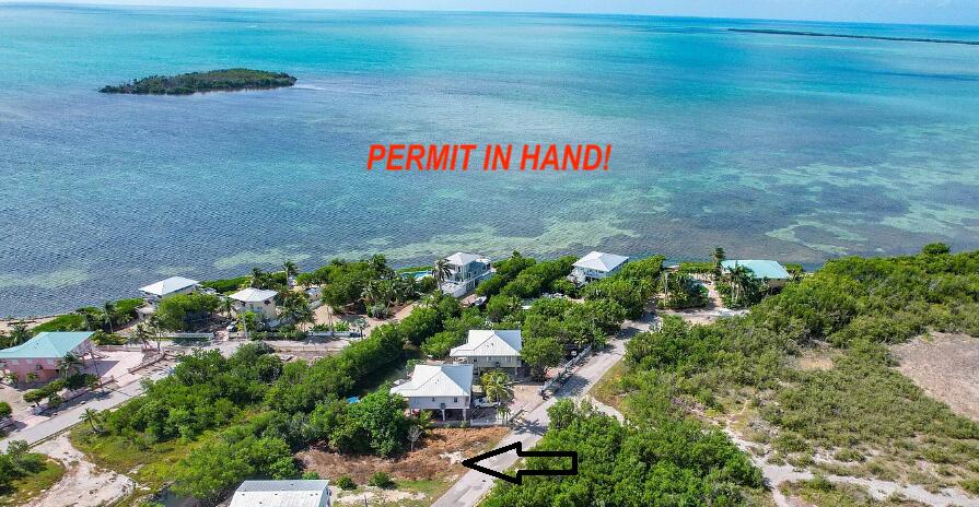 1147 Basque Lane Cudjoe, FL 33042 - Photo 11 of 13 a sign that is sitting in the middle of a yard