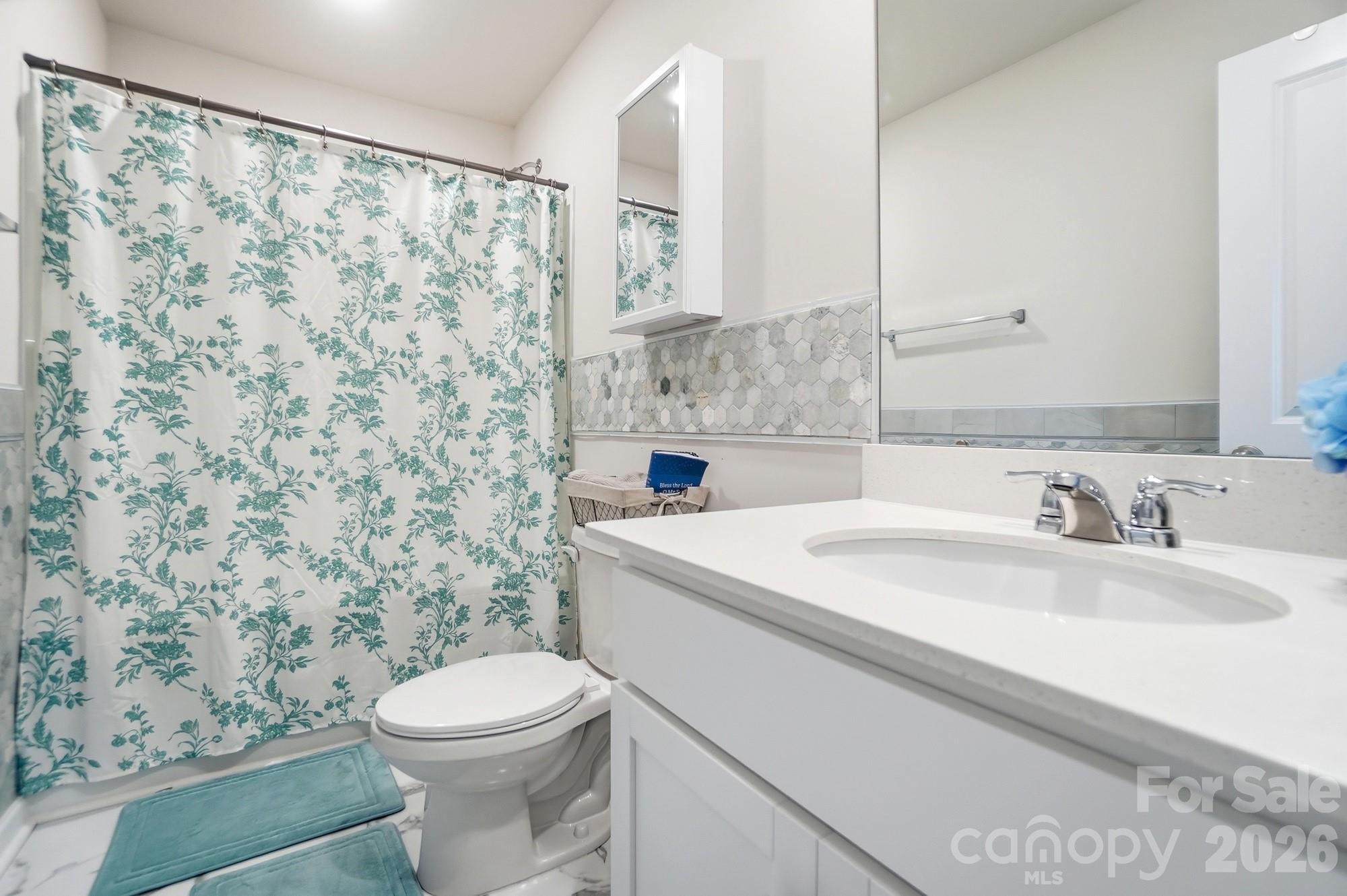 116 Timbergreen Court Troutman, NC 28166 - Photo 28 of 43 a bathroom with a sink toilet and shower