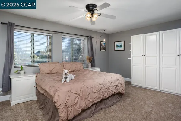 a bedroom with a bed and a table