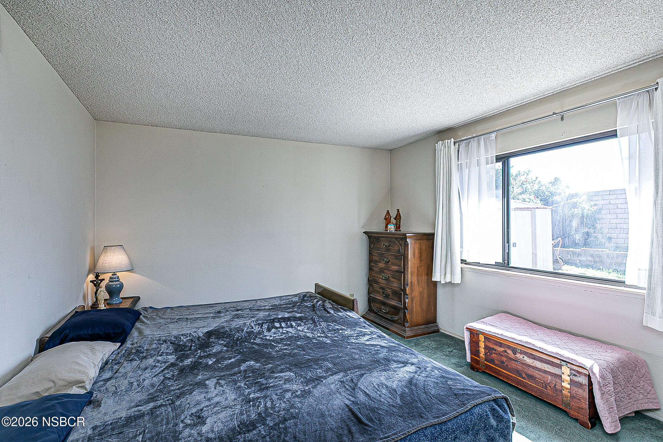 4447 Falcon Drive Lompoc, CA 93436 - Photo 12 of 25 a bedroom with a bed and wooden floor