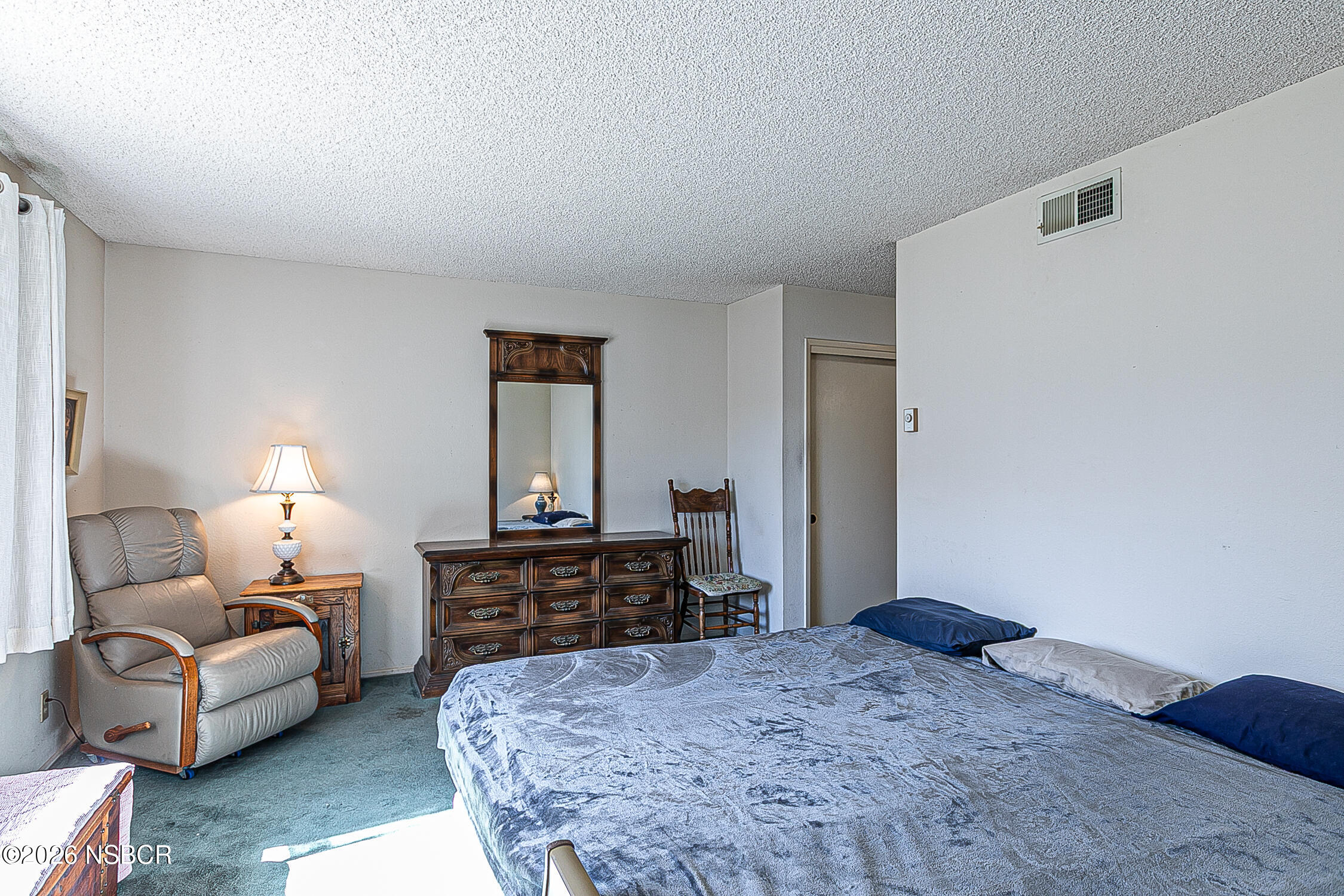 4447 Falcon Drive Lompoc, CA 93436 - Photo 14 of 25 a bedroom with a bed and a couch