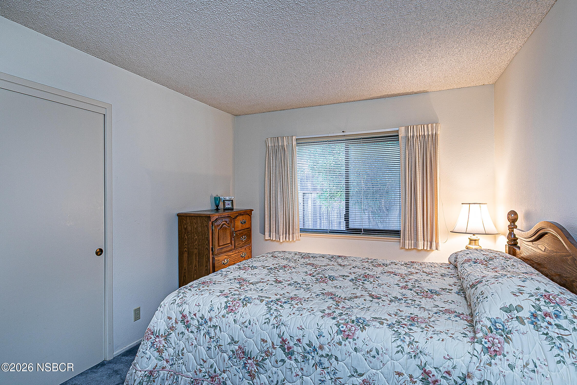 4447 Falcon Drive Lompoc, CA 93436 - Photo 17 of 25 a bedroom with a bed and a dresser
