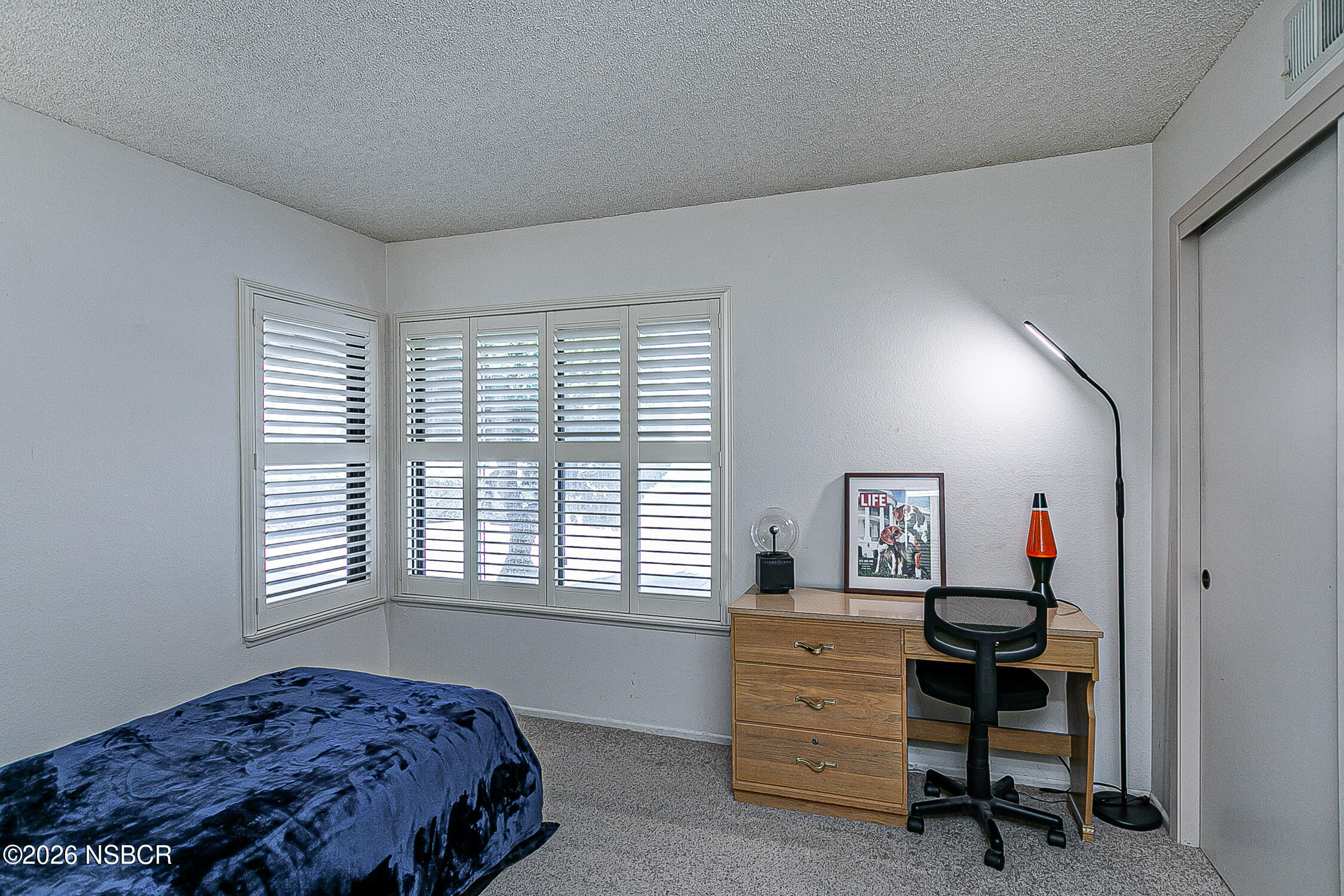 4447 Falcon Drive Lompoc, CA 93436 - Photo 18 of 25 a bedroom with a bed and a window