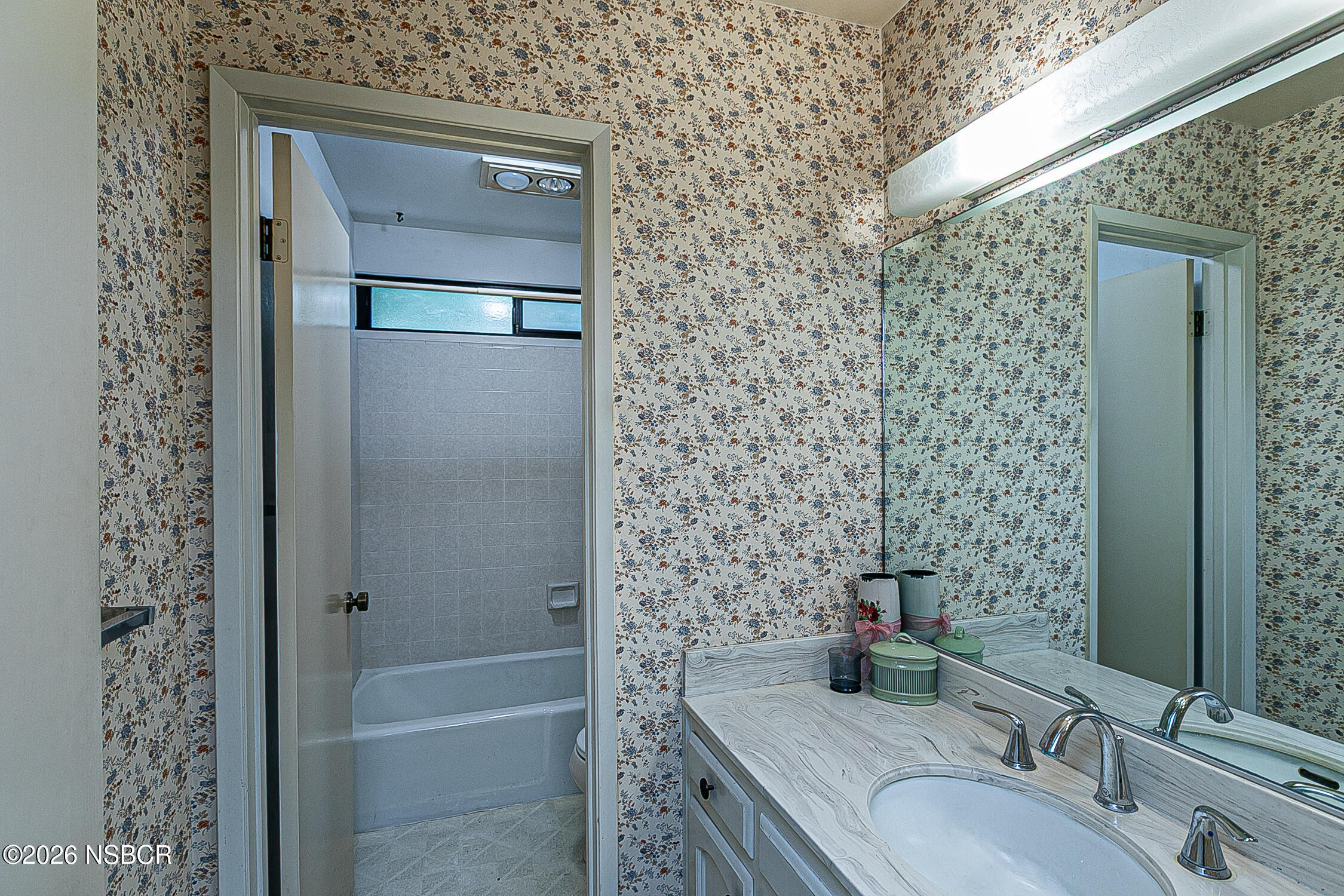 4447 Falcon Drive Lompoc, CA 93436 - Photo 20 of 25 a bathroom with a granite countertop sink a toilet and shower