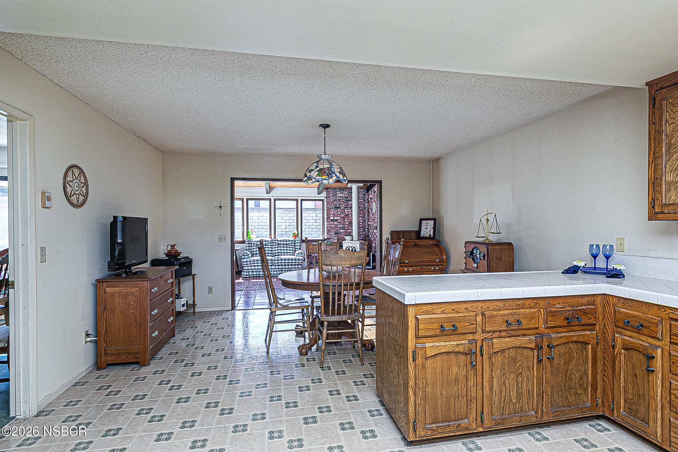 4447 Falcon Drive Lompoc, CA 93436 - Photo 9 of 25 a view of a kitchen with a dining table and chairs