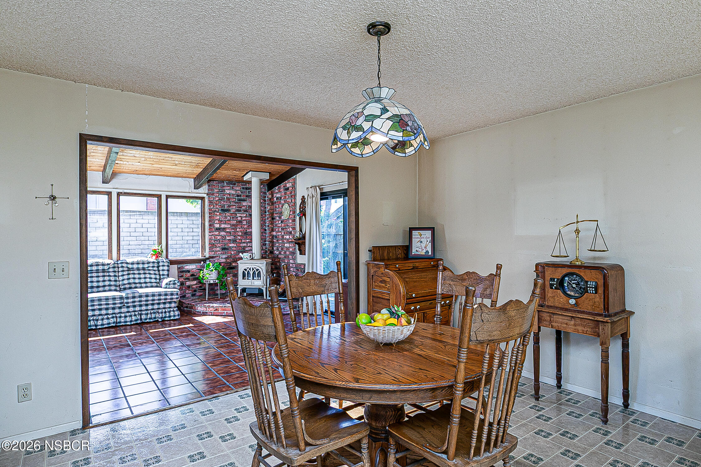 4447 Falcon Drive Lompoc, CA 93436 - Photo 10 of 25 a view of a dining room with furniture a chandelier and wooden floor