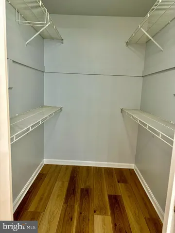 a bathroom with a bathtub and a window