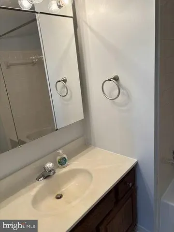 a view of wooden floor and windows in a room