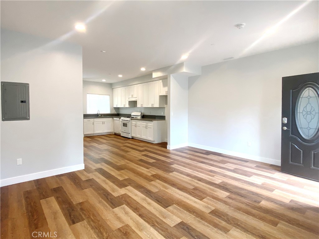 300 East Alhambra Road, Unit E Alhambra, CA 91801 - Photo 5 of 23 a view of a kitchen with wooden floor and a window