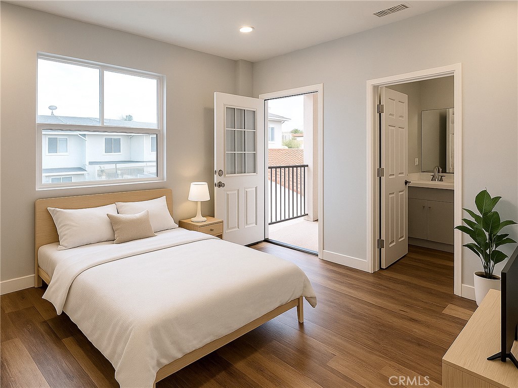 300 East Alhambra Road, Unit E Alhambra, CA 91801 - Photo 9 of 23 a bedroom with a bed and wooden floor