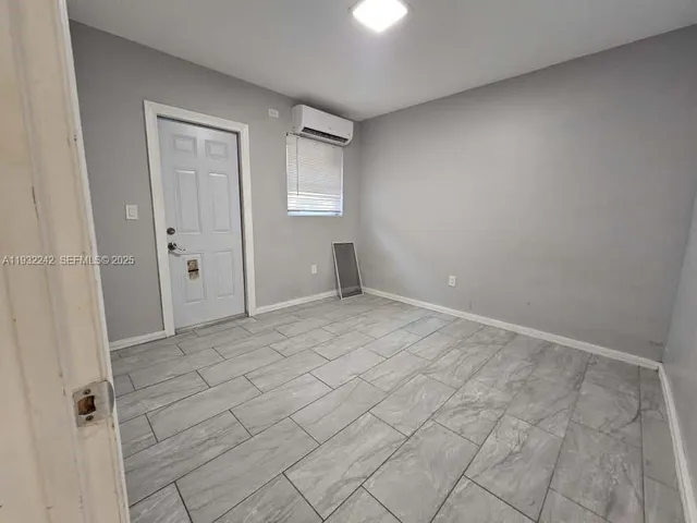 a view of a bathroom from a corridor