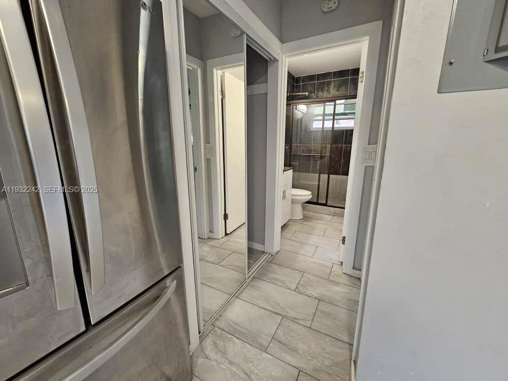950 Northwest 5th Street, Unit 2 Miami, FL 33128 - Photo 4 of 4 a view of a bathroom from a corridor