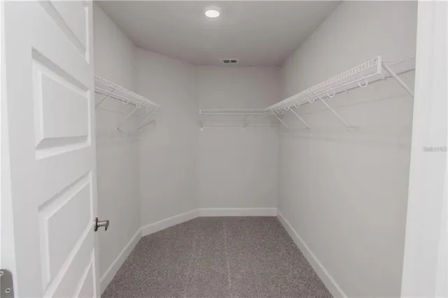 a view of an empty walk in closet