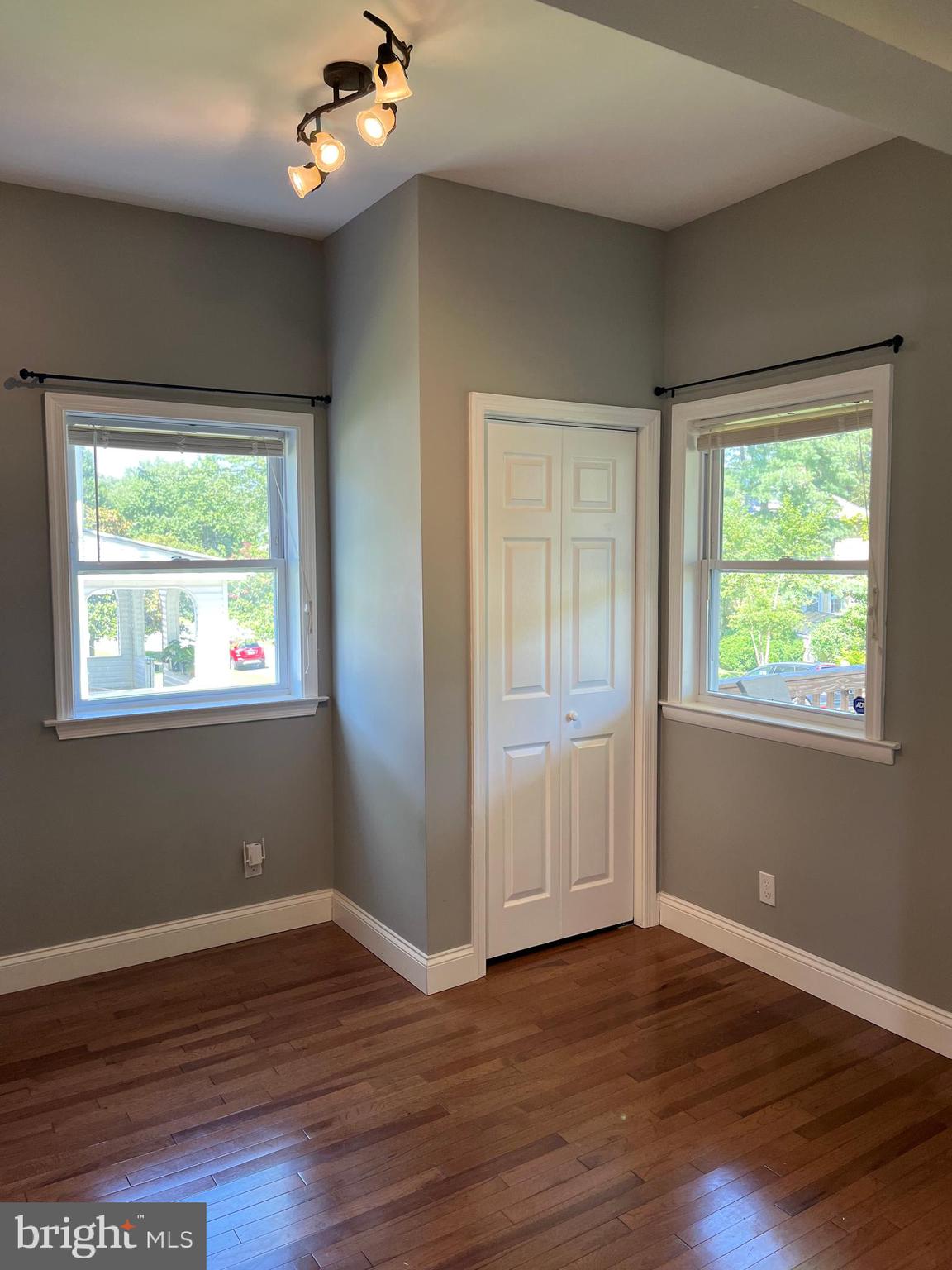 5216 Tramore Road Baltimore, MD 21214 - Photo 12 of 39 a view of an empty room with wooden floor and a window
