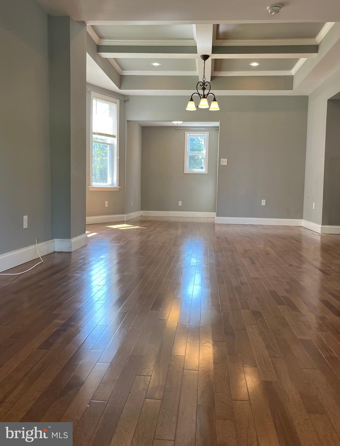 5216 Tramore Road Baltimore, MD 21214 - Photo 3 of 39 a view of empty room with wooden floor and fan