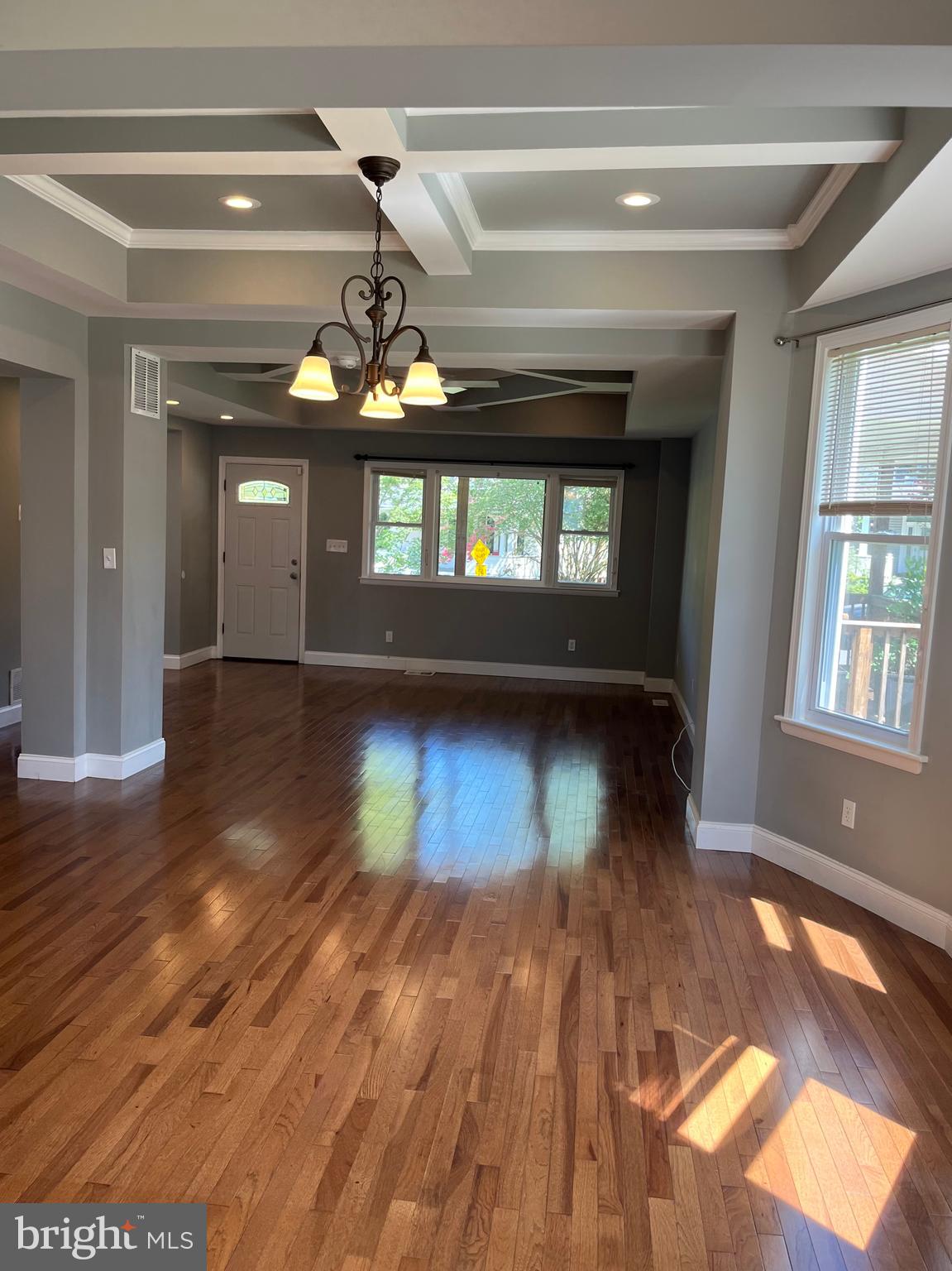 5216 Tramore Road Baltimore, MD 21214 - Photo 7 of 39 a view of empty room with wooden floor and fan