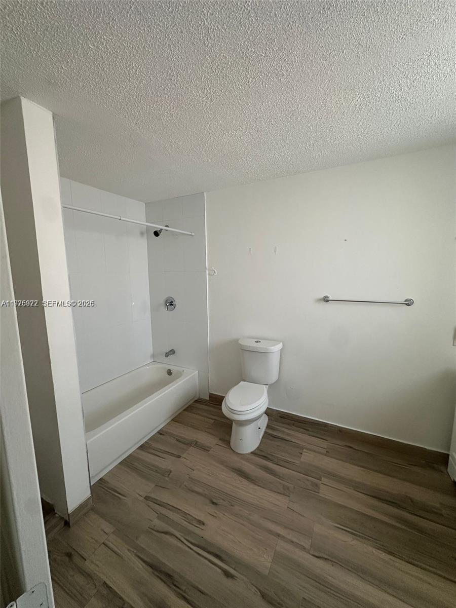 720 Southwest 7th Avenue, Unit 2 Hallandale Beach, FL 33009 - Photo 5 of 7 a bathroom with a toilet and a shower