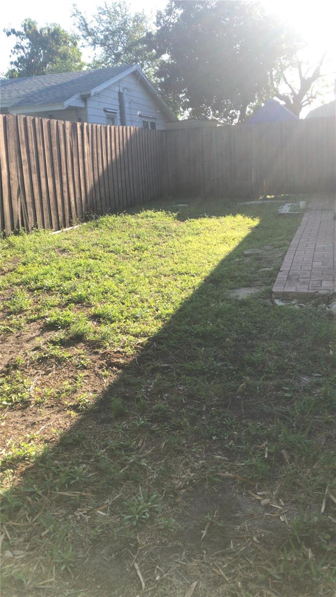 720 Southwest 7th Avenue, Unit 2 Hallandale Beach, FL 33009 - Photo 6 of 7 a view of empty space with wooden fence