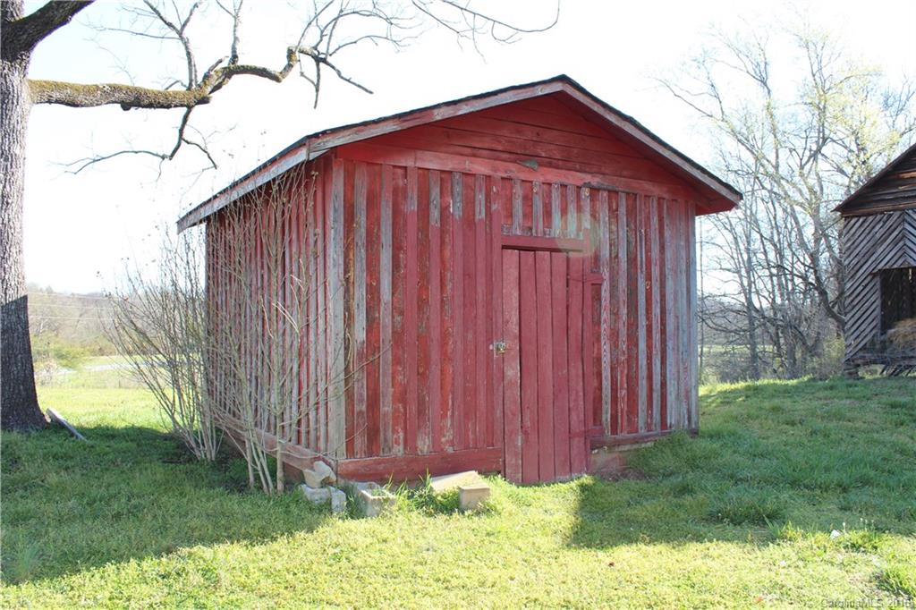 2013 Union Road Rutherfordton, NC 28139 - Photo 17 of 21 a view of barn with a small yard and wooden fence