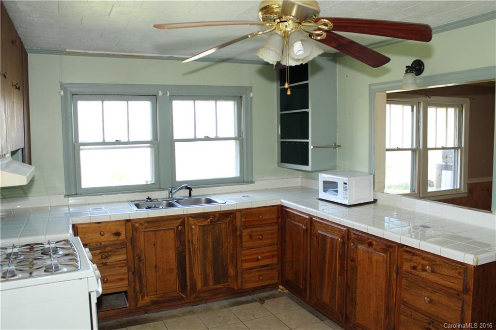 2013 Union Road Rutherfordton, NC 28139 - Photo 6 of 21 a kitchen with a sink stove and window