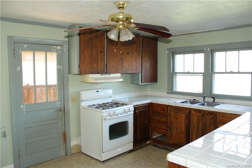 2013 Union Road Rutherfordton, NC 28139 - Photo 7 of 21 a kitchen with a sink stove and cabinets