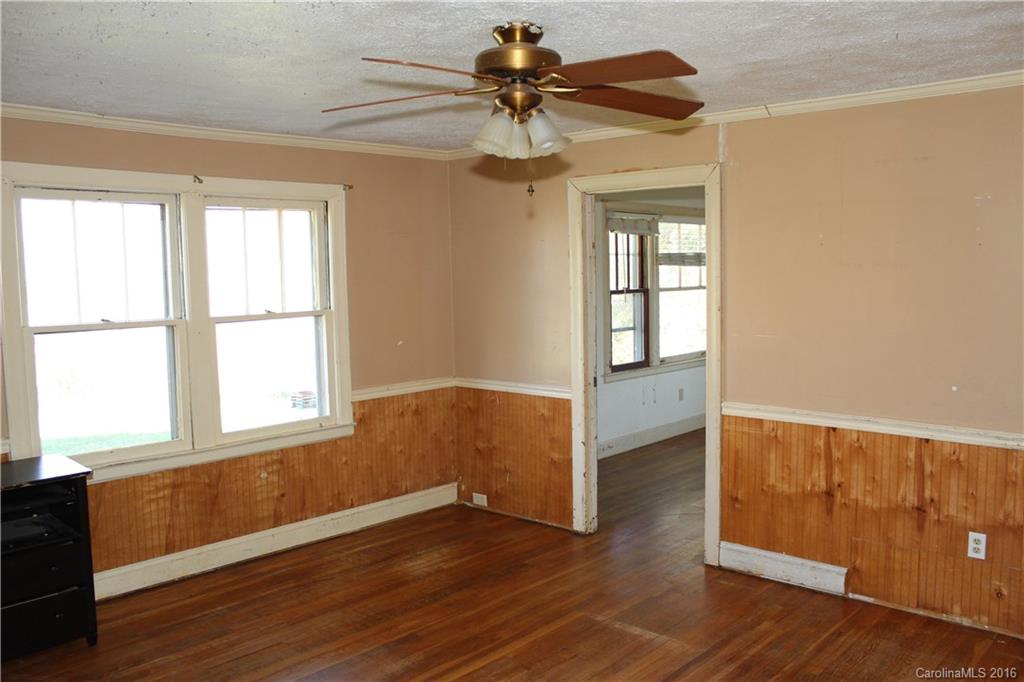 2013 Union Road Rutherfordton, NC 28139 - Photo 10 of 21 a view of an empty room with window and wooden floor