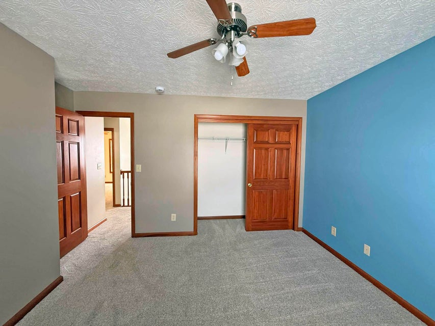 541 North Point Troy, OH 45373 - Photo 17 of 23 This inviting bedroom features soft carpeting, a ceiling fan, and ample closet space for comfortable living.