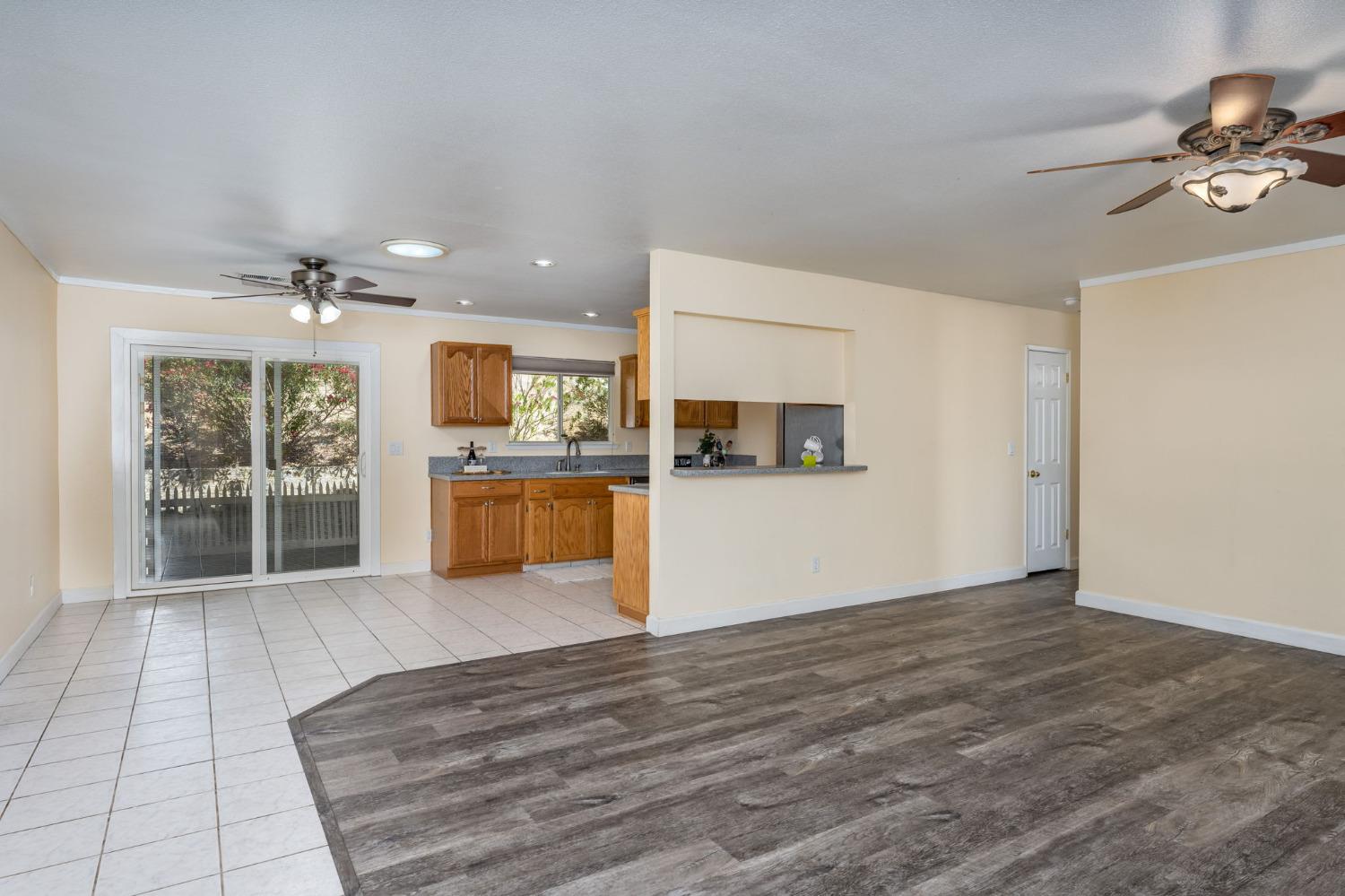 44909 Person Loop North Coarsegold, CA 93614 - Photo 11 of 32 a view of a kitchen with microwave and refrigerator