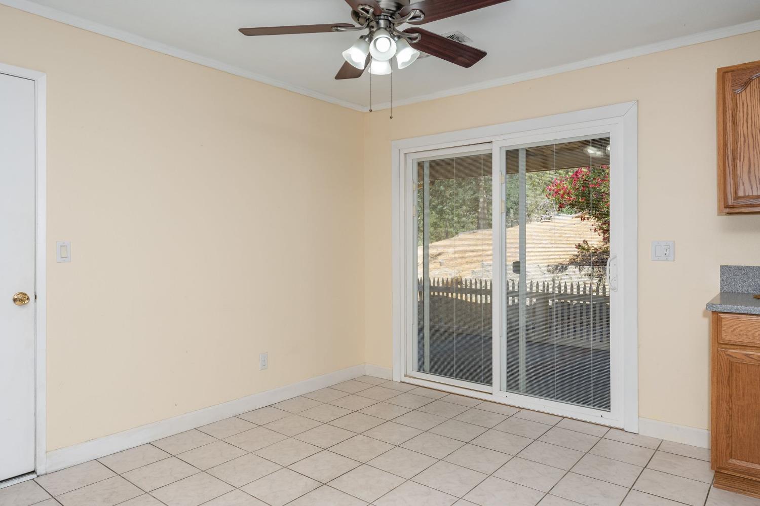 44909 Person Loop North Coarsegold, CA 93614 - Photo 13 of 32 a view of empty room with wooden floor and fan
