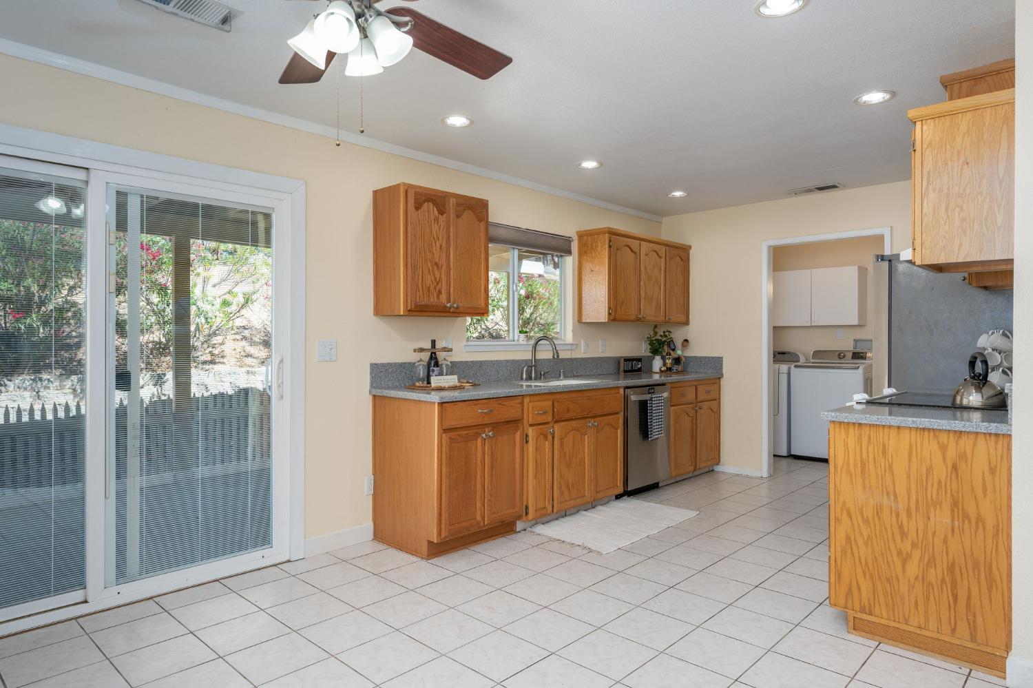 44909 Person Loop North Coarsegold, CA 93614 - Photo 14 of 32 a large kitchen with cabinets