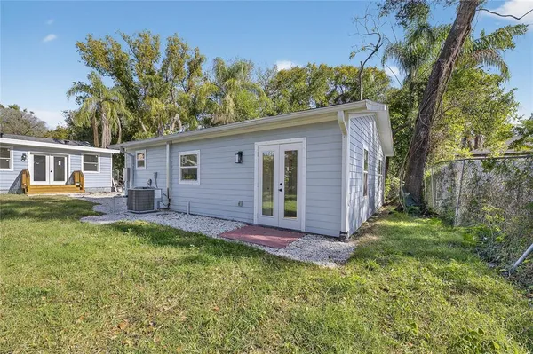 a front view of house with yard and green space