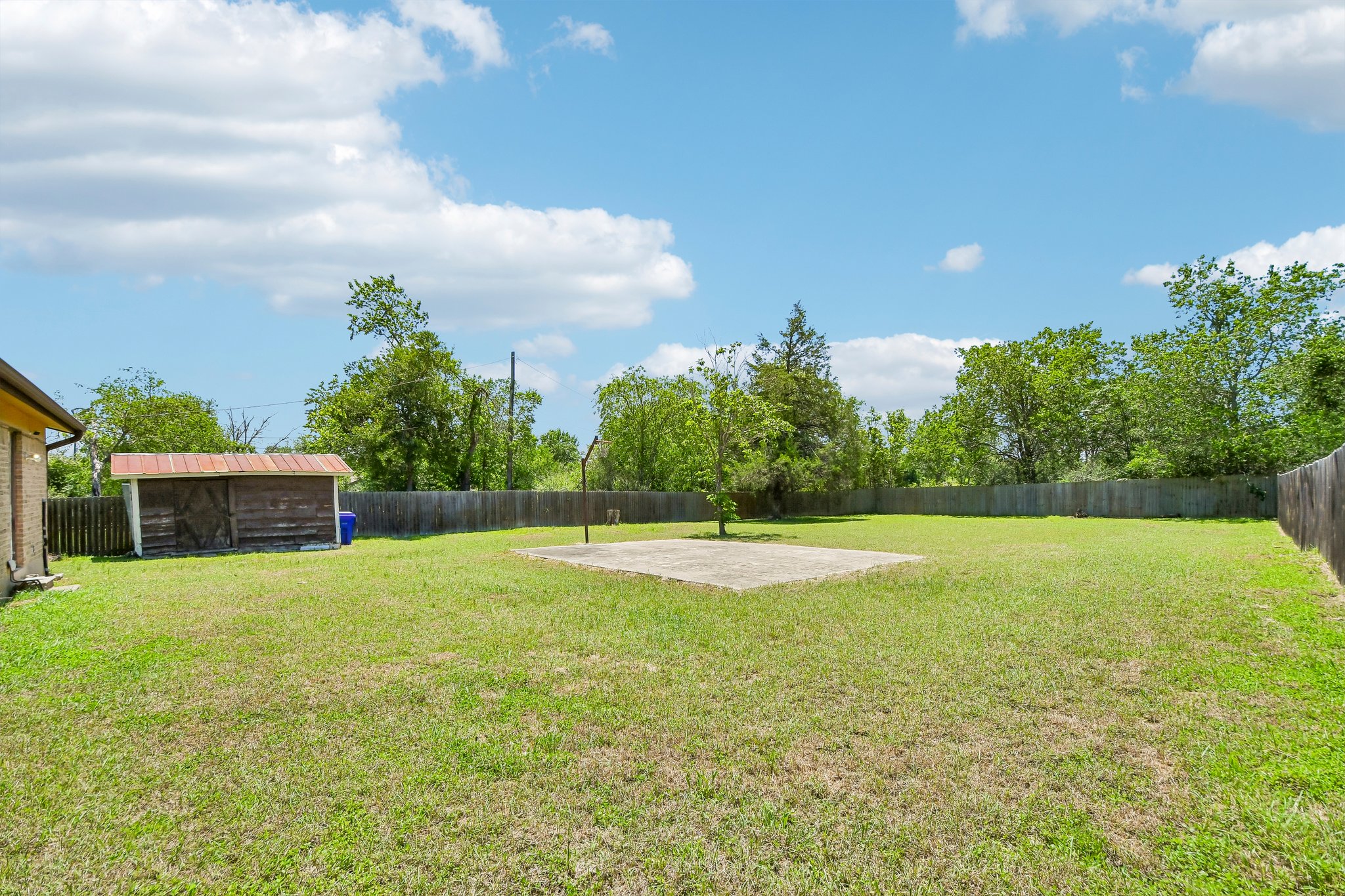 101 Brown Street Elgin, TX 78621 - Photo 28 of 32 a swimming pool with trees in the background