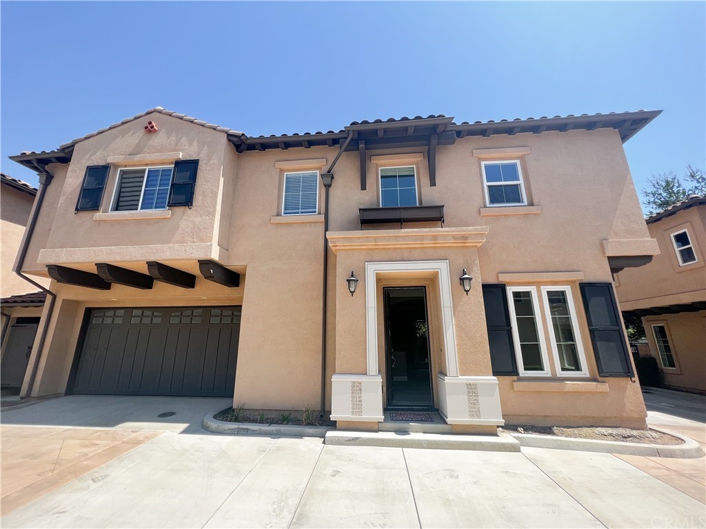 a front view of a house with a garage