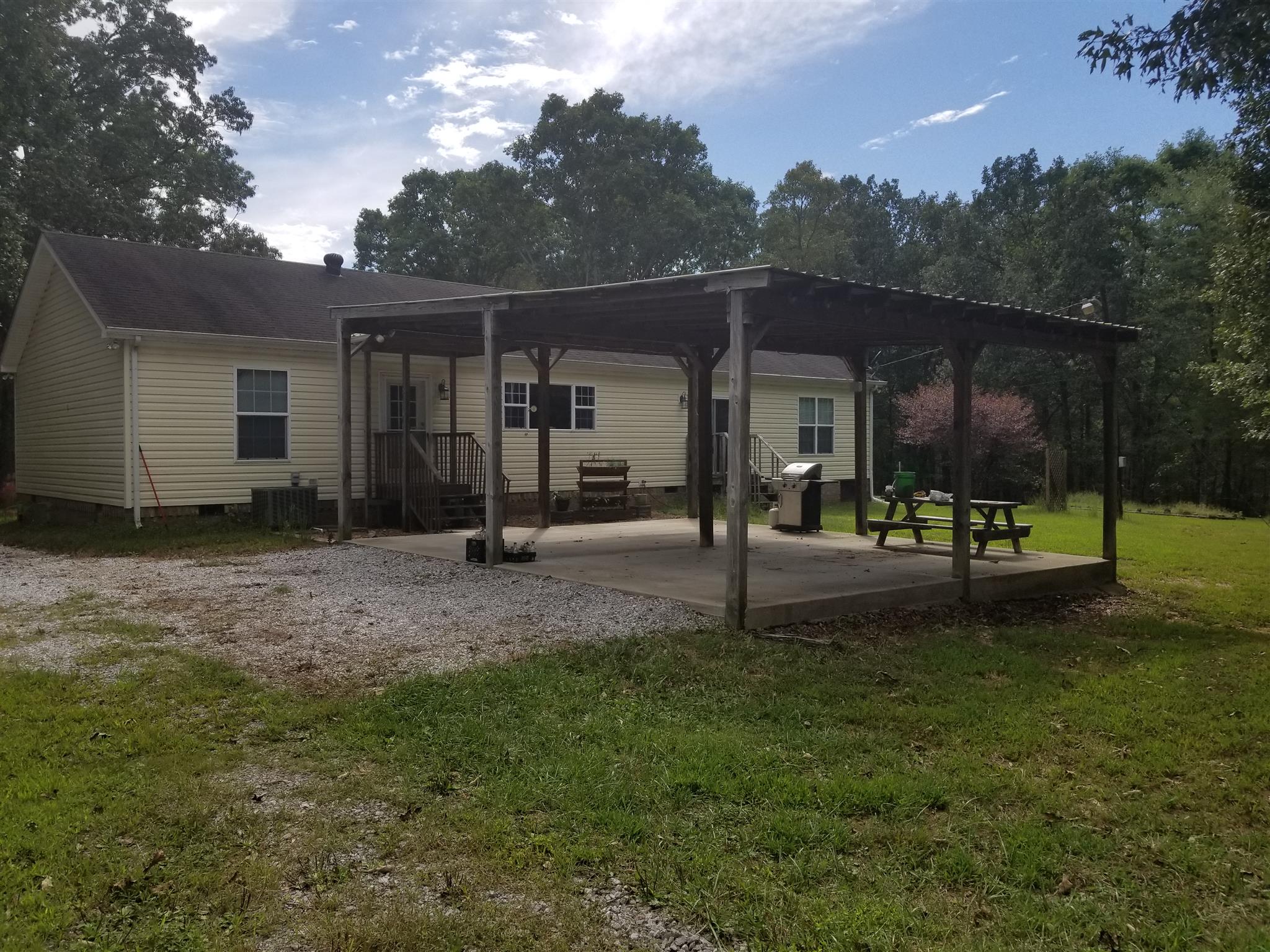 236 Fire Tower Road Dickson, TN 37055 - Photo 5 of 24 Attached carport can also be used for outdoor entertaining.
