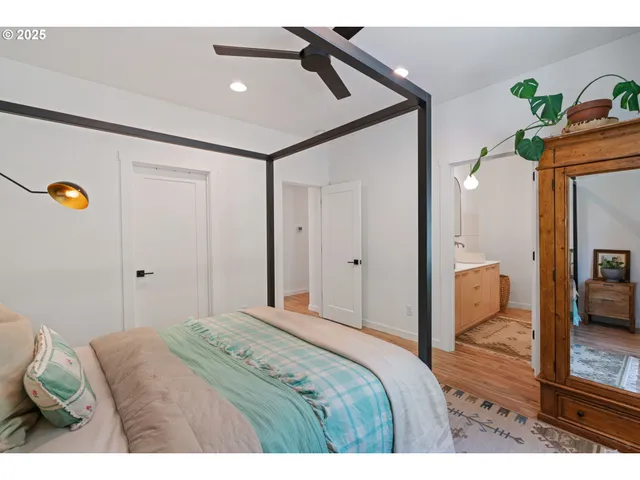 a bedroom with a bed and a lamp