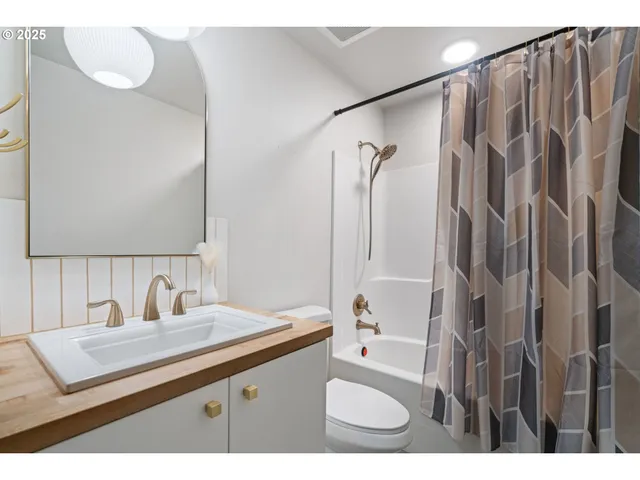 a bathroom with a sink double vanity and a mirror