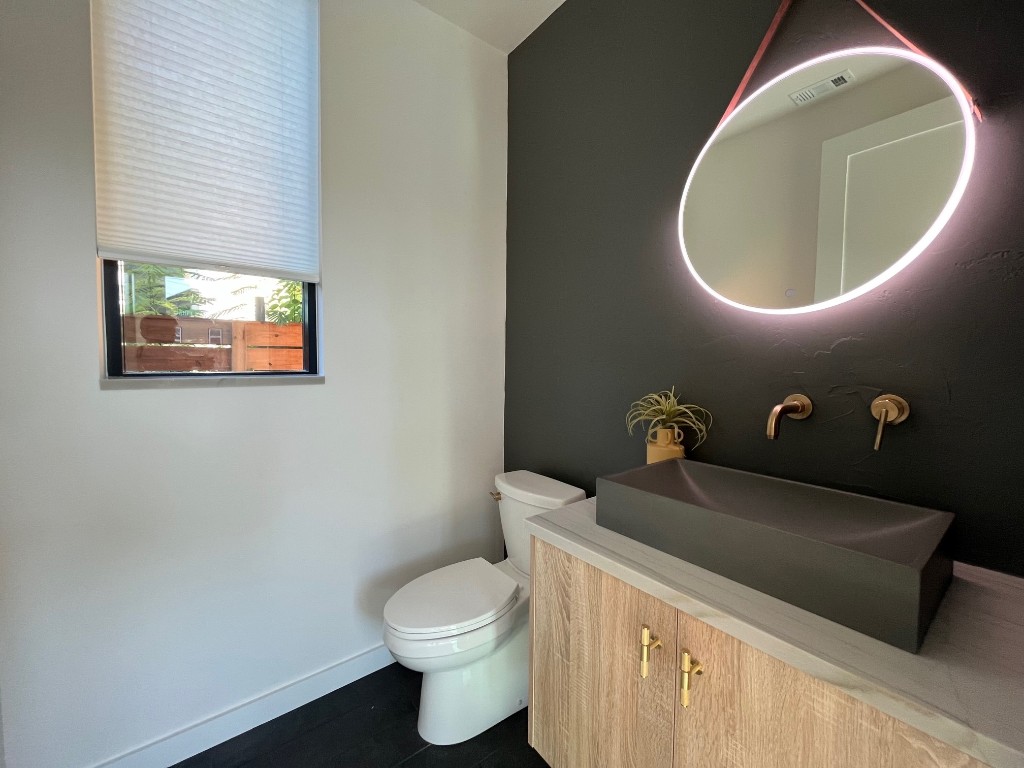 1901 Hamilton Avenue Austin, TX 78702 - Photo 13 of 37 a bathroom with a toilet and a sink