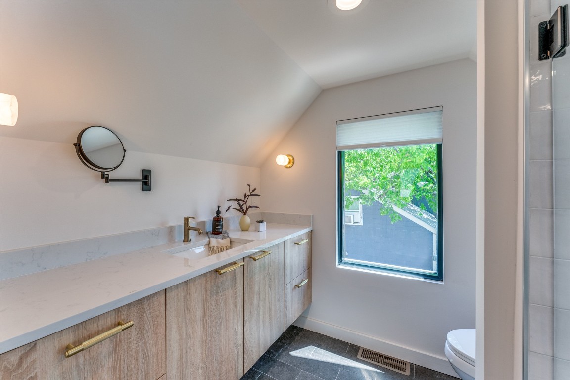 1901 Hamilton Avenue Austin, TX 78702 - Photo 16 of 37 a bathroom with a double vanity sink and a toilet